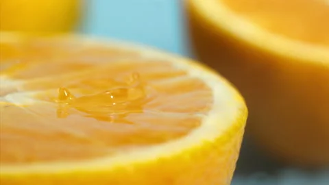 Orange fall into the water on  background Super slow-mo 1000 fps Stock Footage 163961628