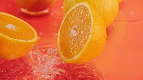 Orange fall into the water on  background Super slow-mo 1000 fps Stock Footage 163961956