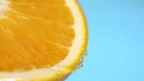 Orange fall into the water on  background Super slow-mo 1000 fps Stock Footage 163961997