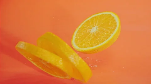 Orange fall into the water on orange background Super slow-mo 1000 fps Stock Footage 276732183