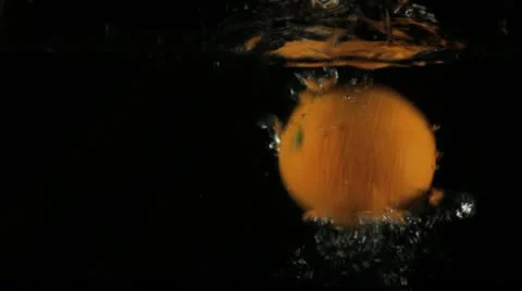 Orange Falling in Water Stock Footage 11236077