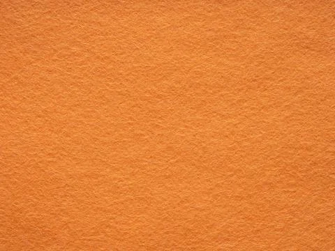 Orange felt texture. Saturated background for Christmas desktop, holiday New Stock Photos