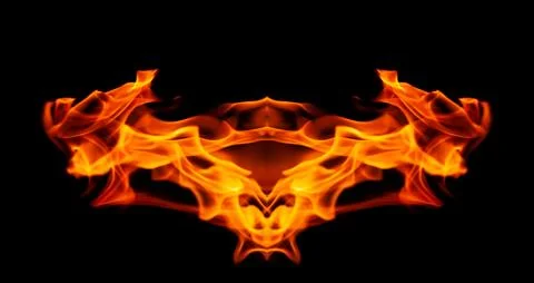 Orange fire flames on a black background Stock Photos