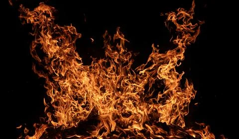 Orange Fire Flames. Burning Fire Texture. Black Background Wallpaper. Drama.. Stock Photos