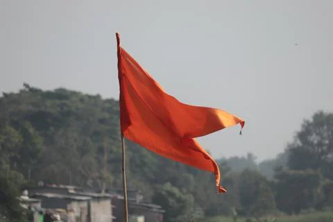 Orange flag with blurred background Stock Photos