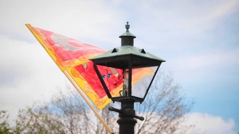 Orange Flag Waves On lamp-post Stock Footage 100981007