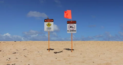Orange Flag Waving In The Wind At NO SWIMMING With STRONG CURRENT Warning 스톡 동영상 166427886