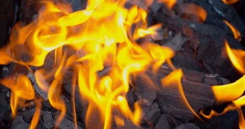 Orange flame on black close-up view Stock Footage 115783657