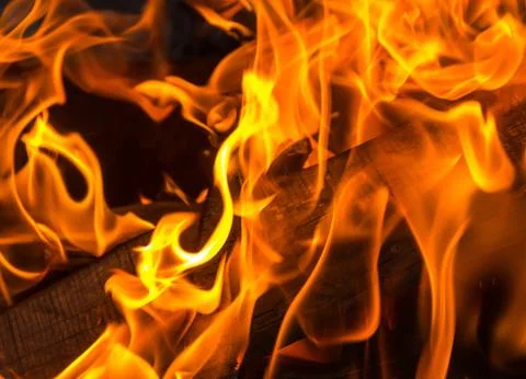 Orange flame bright background. burning fuel for the fire board close-up Stock Photos