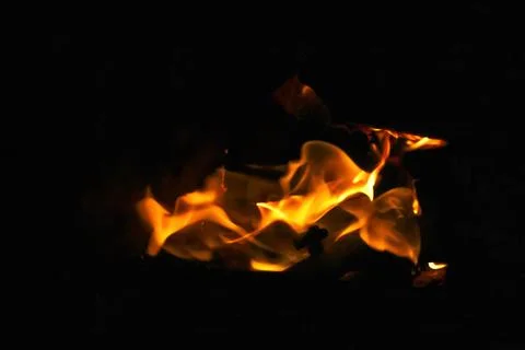 Orange flame fire on black background. Dramatic flames flickering against t.. Stock Photos