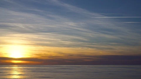 Orange flame sunset landscape with sun reflected in the water 스톡 동영상 106664242