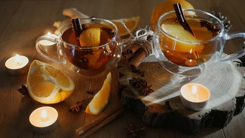 Orange flavored tea with cinnamon and cardamom in cup, orange and cinnamon st Stock Footage 121583246