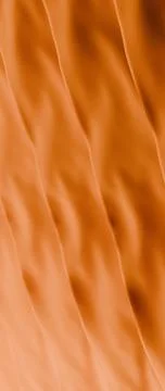 Orange Flowing Fabric Texture Abstract vertical background Ilustración de archivo