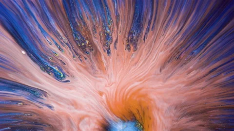 Orange flows over gold and blue particles. Abstract liquid art pigments, makeup  스톡 동영상 137961346