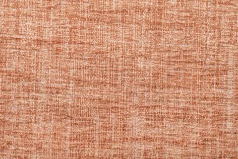 Orange fluffy background of soft, fleecy cloth. Texture of textile closeup. Stock Photos