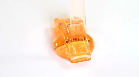 Orange fluid gel on white background Stock Footage 35570174