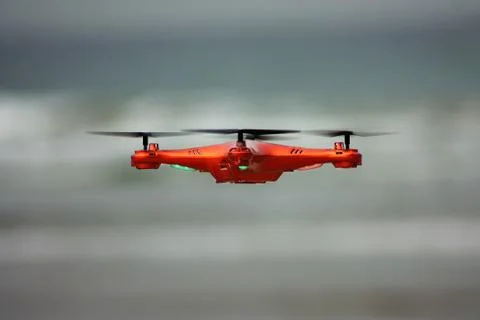 Orange flying drone Foto stock
