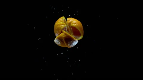 Orange flying into view and exploding Stock Footage 165215862