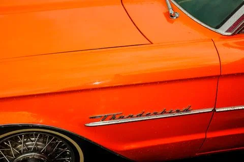Orange Ford Thunderbird close front wing, and hood, wheel tire,  badge Stock Photos