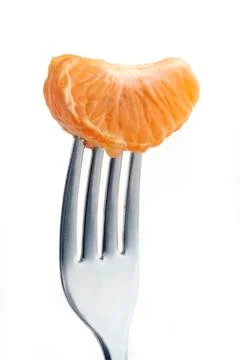 Orange on fork Stock Photos