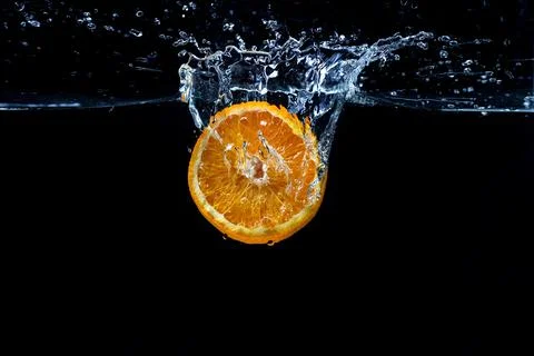 Orange with fresh water splash Stock Photos