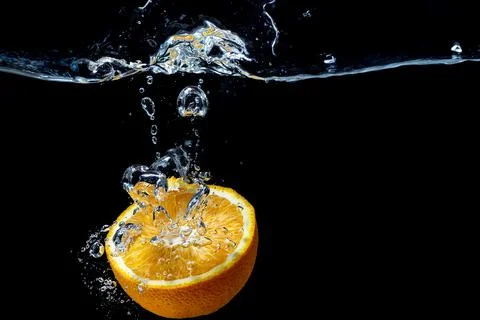 Orange with fresh water splash Stock Photos