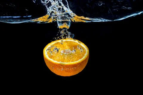Orange with fresh water splash Stock Photos