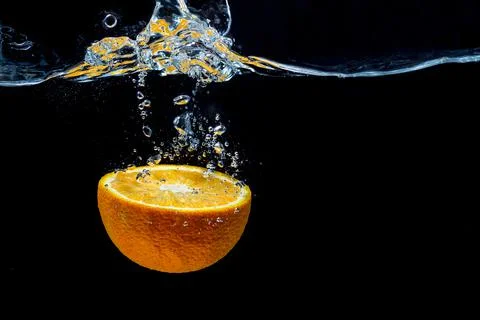 Orange with fresh water splash Stock Photos
