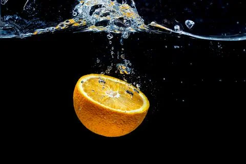 Orange with fresh water splash Stock Photos