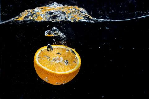 Orange with fresh water splash Stock Photos