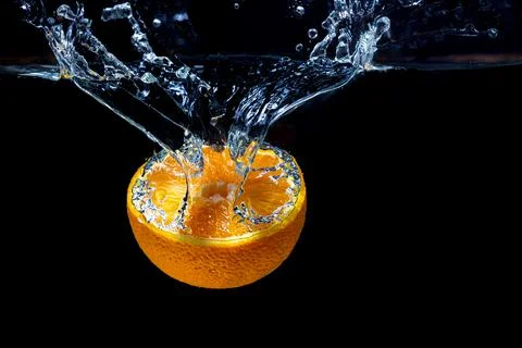Orange with fresh water splash Stock Photos