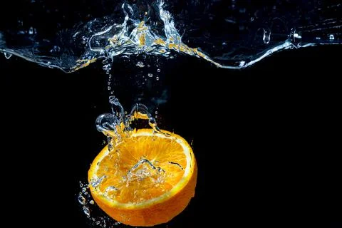 Orange with fresh water splash Stock Photos