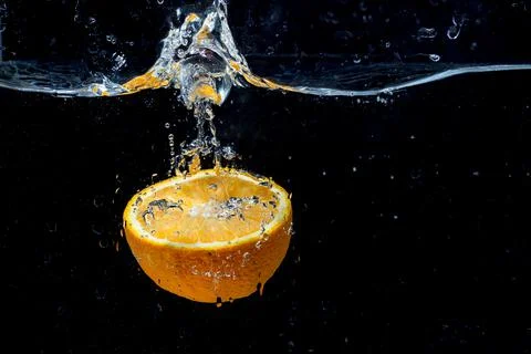 Orange with fresh water splash Stock Photos