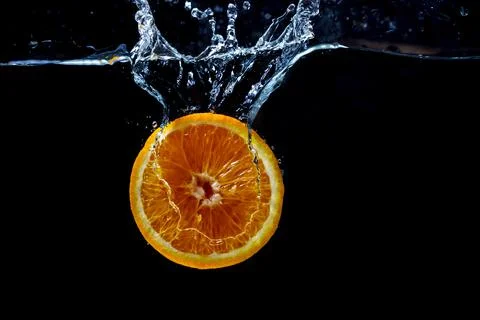 Orange with fresh water splash Stock Photos