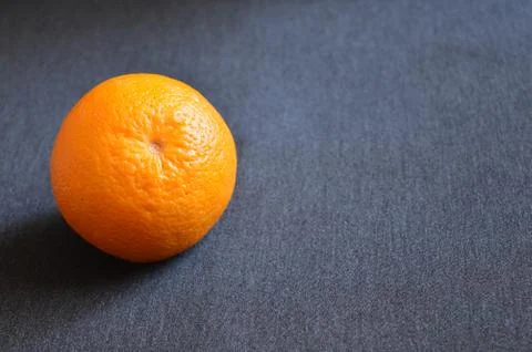 Orange fruit on black background Stock Photos