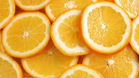 Orange fruit. Camera moving up and shows lot of sliced oranges. Close-up Stockbeeldmateriaal 168467762