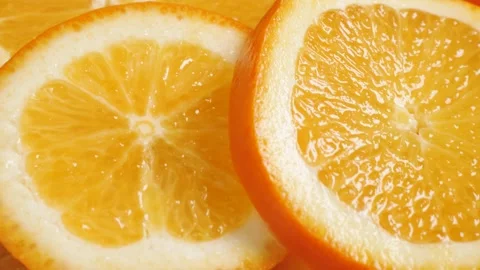 Orange fruit. Camera slowly pans up to show beautiful juicy sliced oranges Stock-Footage 168467742