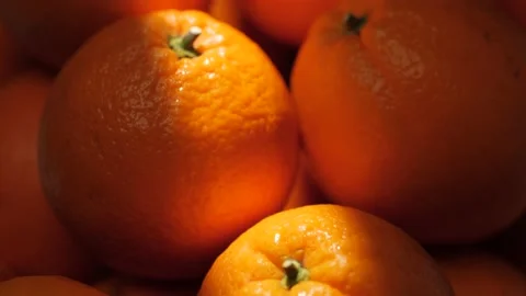 Orange fruit. Close-up of oranges in shade on which ray of sunlight falls 動画素材 171895696