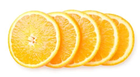 Orange fruit cut into circles on a white background. The view of top. Stock Photos