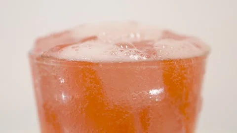 Orange Fruit Drink with Ice in Glass Closeup Stock Footage 340123957