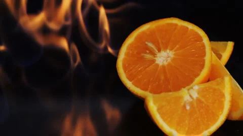 Orange fruit in fire flame Stock Footage 5298358