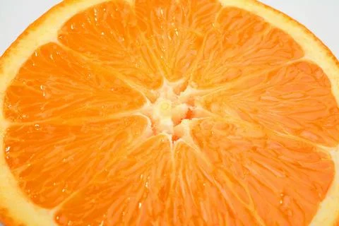 Orange fruit half close-up Stock Photos