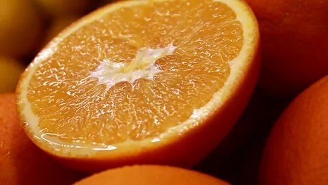Orange fruit half slice. Fresh juicy citrus. Macro slide shot. Stock-Footage 146626919