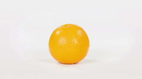 Orange fruit isolated on white background, close up rotation. Video stock 63394446