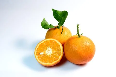 Orange Fruit with Leaves Stock Photos