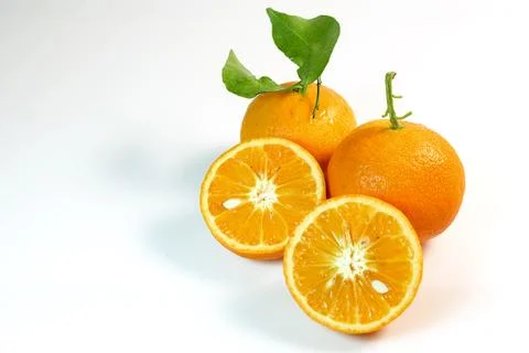 Orange Fruit with Leaves Stock Photos