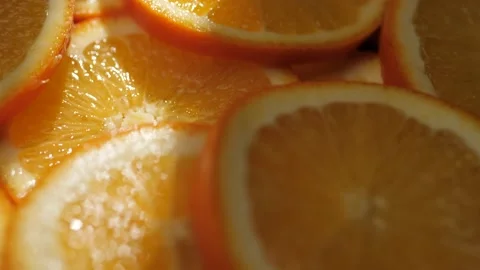 Orange fruit. Macro shot of camera moves slowly showing sliced of fresh juicy Video stock 168467871