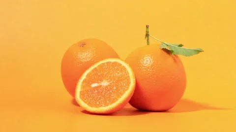 The orange fruit with orange peels on orange background Stock-Footage 197148356