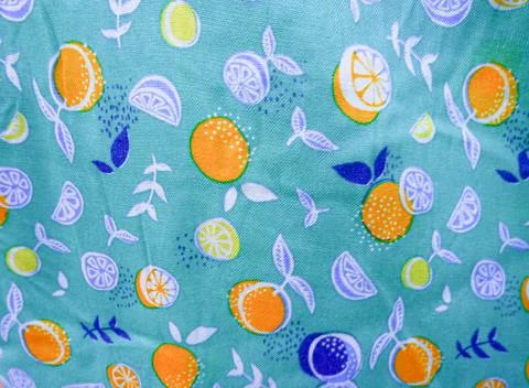 Orange fruit pattern fabric background on finished fabric. Stock Photos
