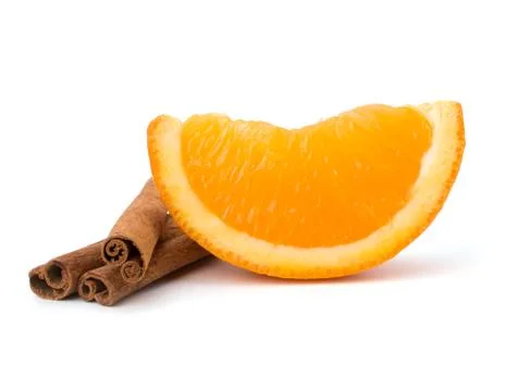 Orange fruit segment and  cinnamon sticks isolated on white background. Stock Photos